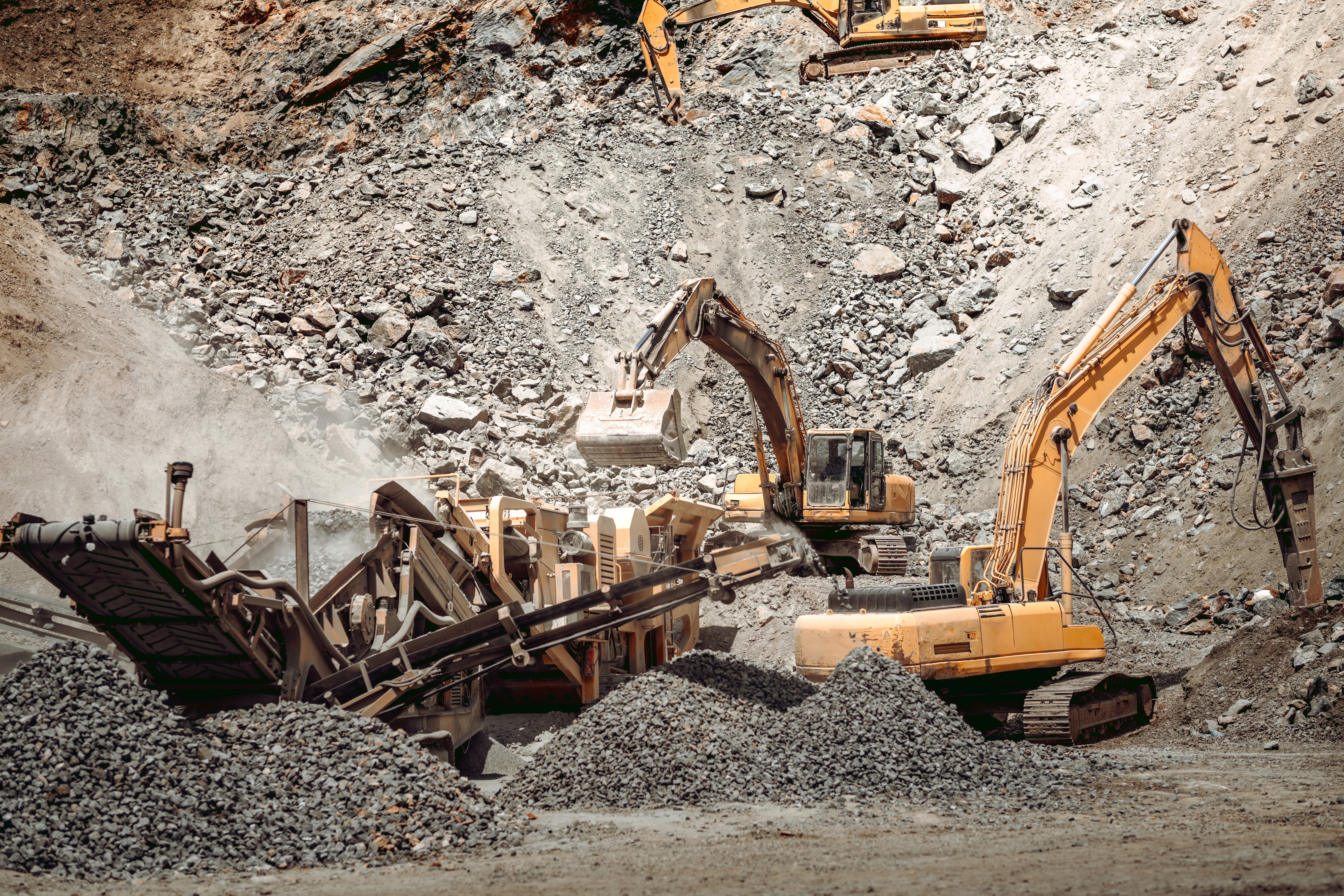 Industrial dumper trucks, wheel loader bulldozer, excavator and track type excavator working on highway construction site, heavy duty machinery activity